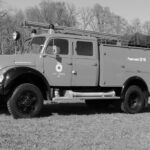 fwv-feuerwehr-lenzburg-tanker-61-auf-wiese-seitenansicht